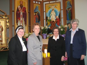 Sr. Ruth Plante (right)  Provincial; Sr. Margaret Ann (second right) Andrako, Assistant; and Sr. Sylvia Burnett (second left) and Sr. Joanne Lickvar (left) as Councilors. 